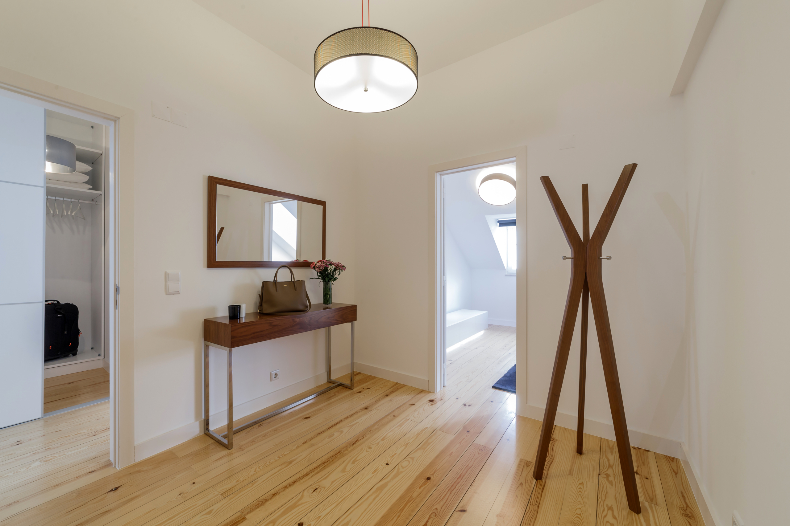 Modern apartment with white walls and light wooden floor Studio with courtyard
